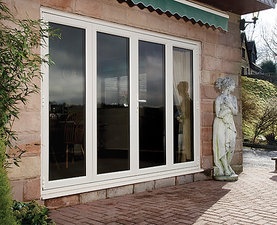 White aluminium bi-folding doors closed