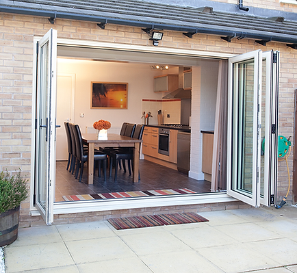 Bi-folding doors fully open showing garden access