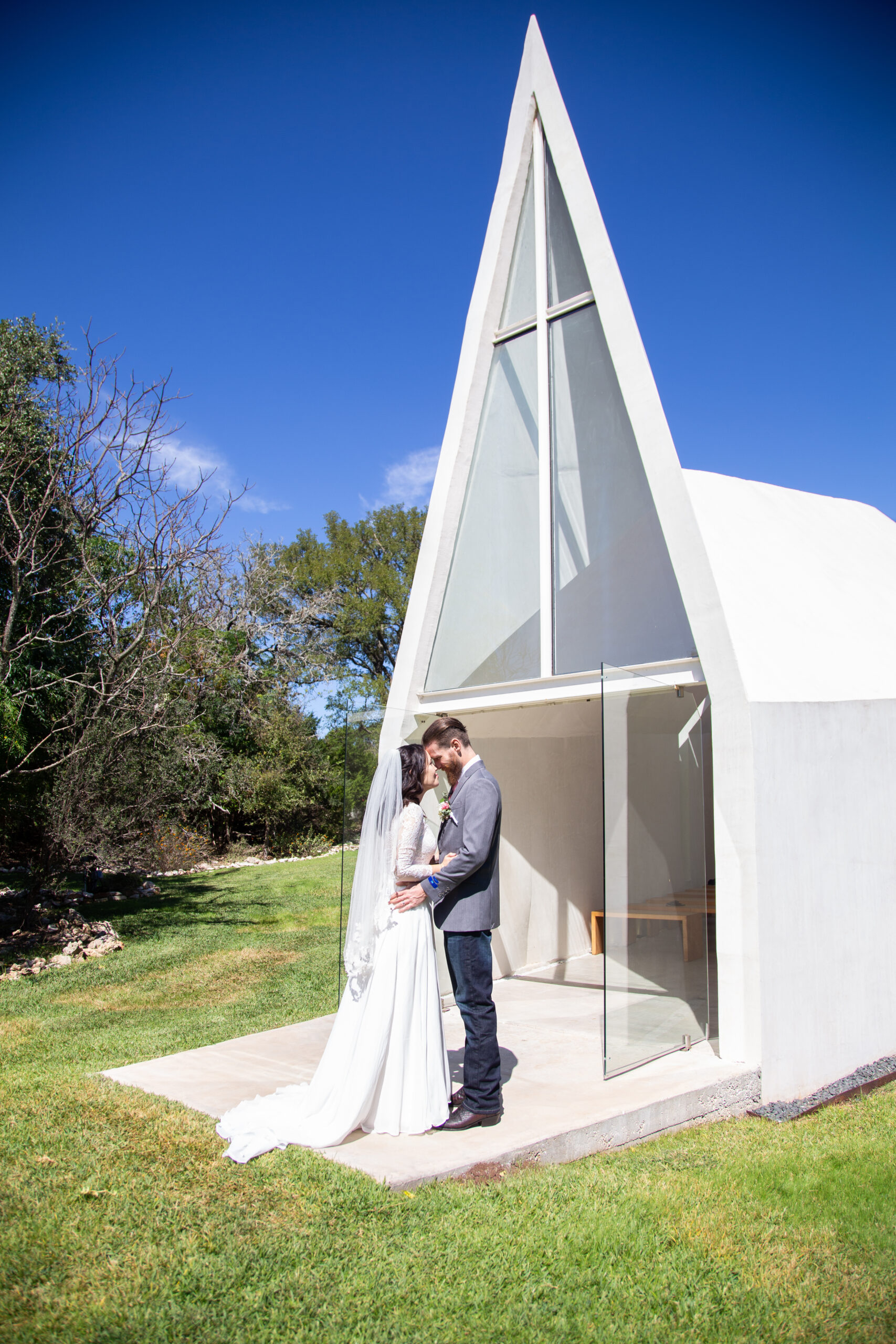 Intimate wedding portrait in lush greenery