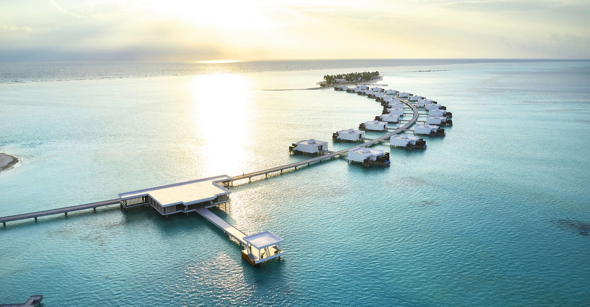 Aerial view of Riu Palace Maldivas overwater villas above turquoise Indian Ocean lagoon