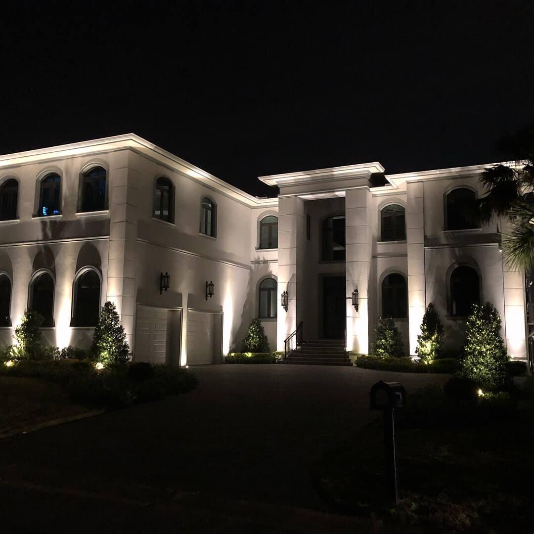 Residential outdoor lighting design highlighting home architecture after dark