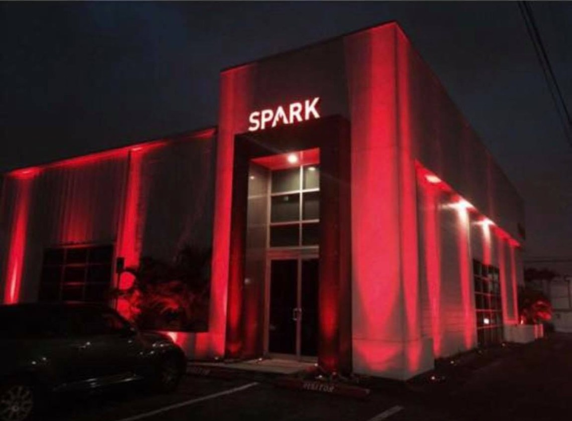 Commercial building night exterior lighting with dramatic facade illumination