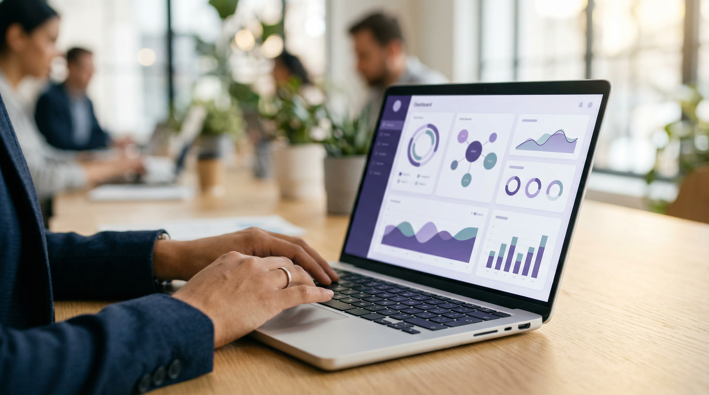 Professional using Mindful wellness tracking app on laptop in modern office