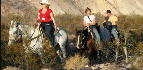 Sunset horseback riding in the Sunrise Mountains