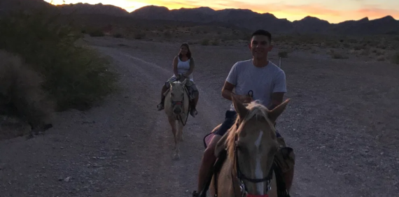 Riders on horses along a desert trail near Las Vegas