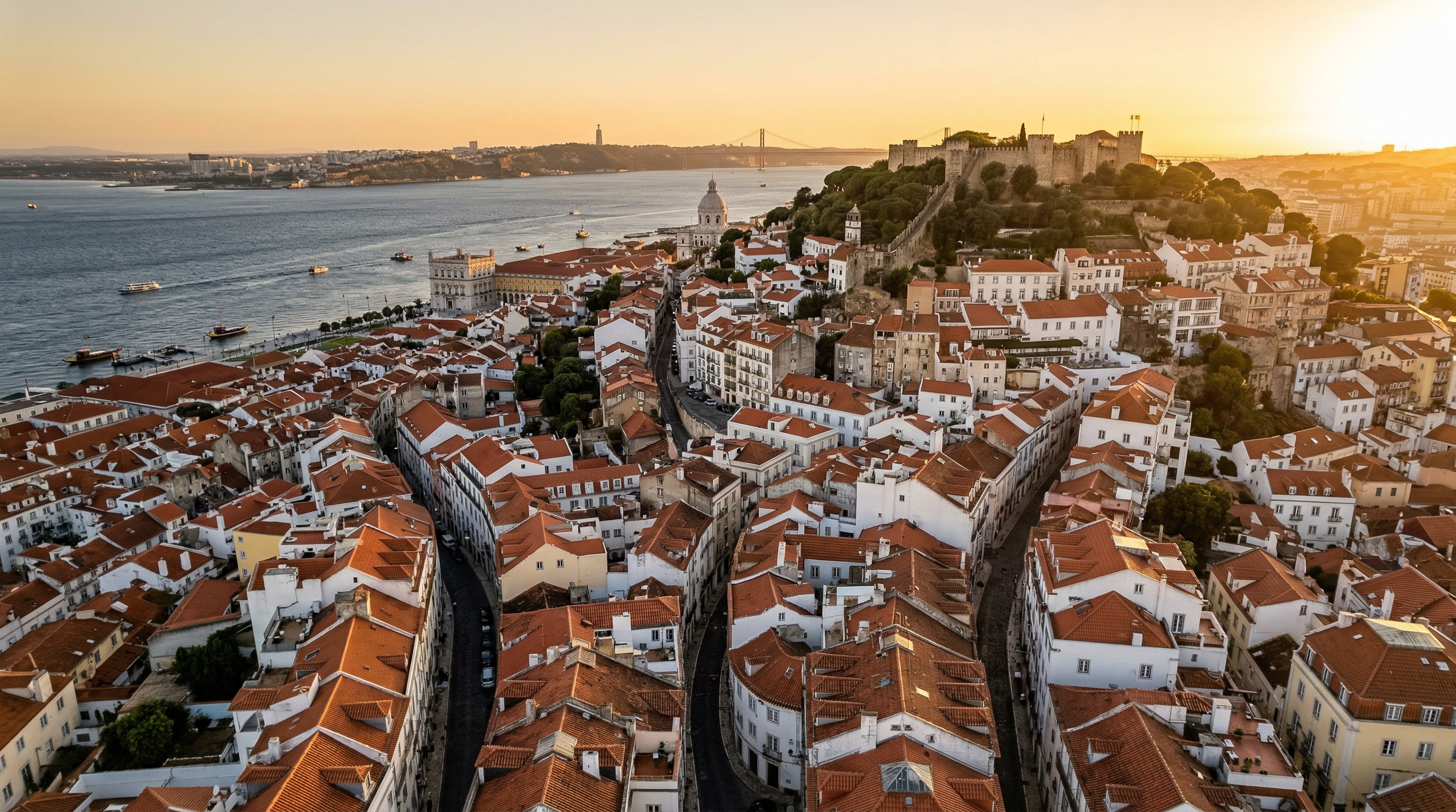 Aerial view of Lisbon's historic Alfama district at golden hour