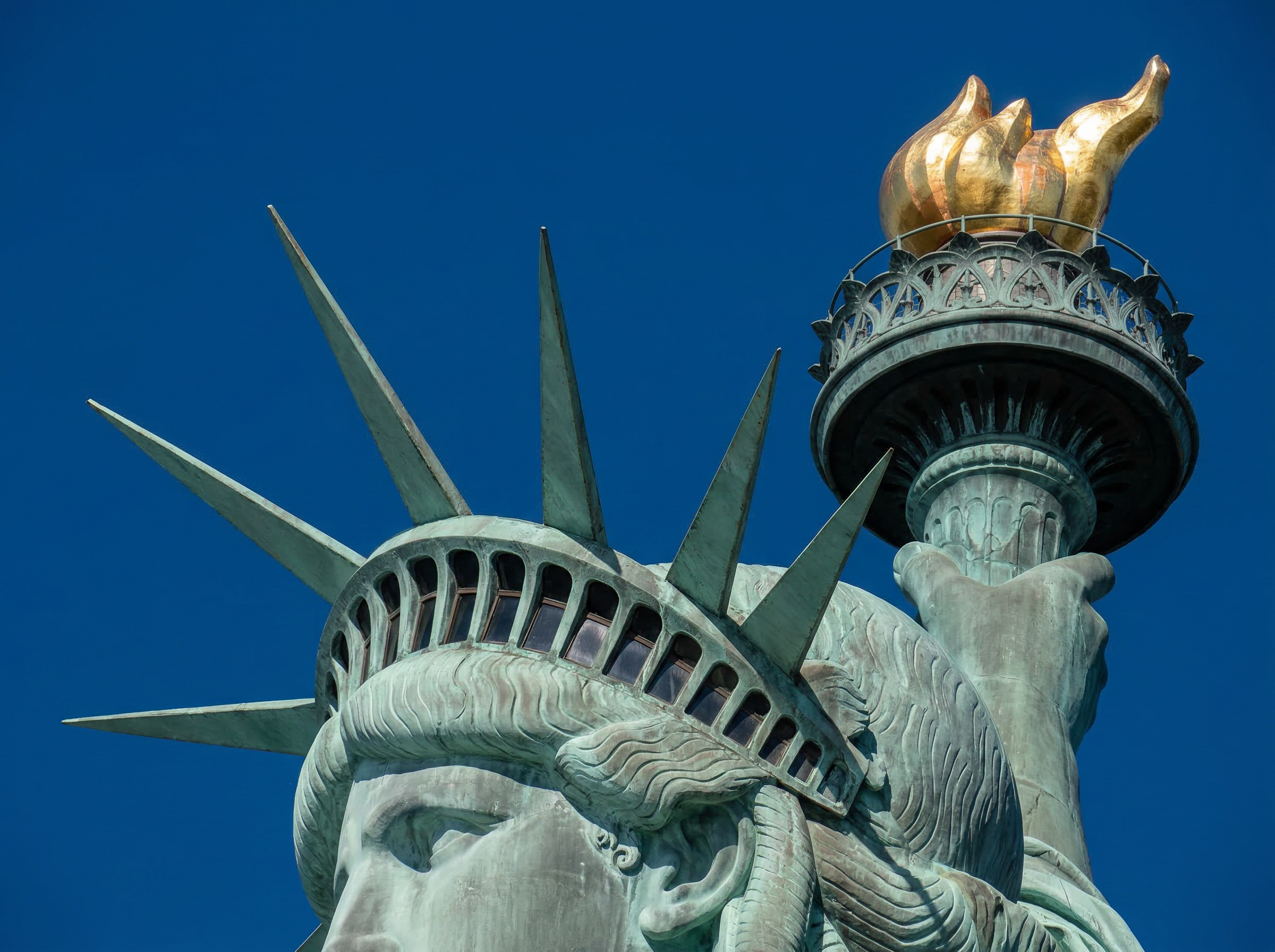 Statue of Liberty crown and torch — seven spires representing the seven continents