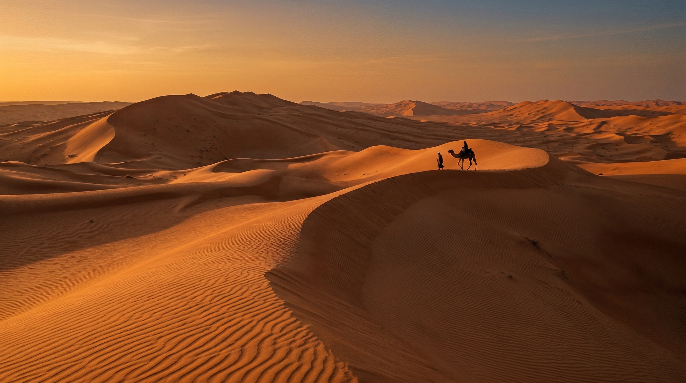 Wahiba Sands desert dunes at golden hour, Oman
